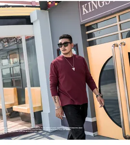 Casual plus size men's long sleeve crew neck T-shirt in burgundy solid color.