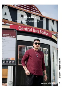 Professional model shot of a plus size men's solid burgundy long sleeve crew neck tee