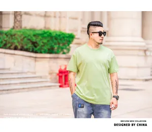 Plus size men's loose drop shoulder t-shirt in light green summer fashion urban style