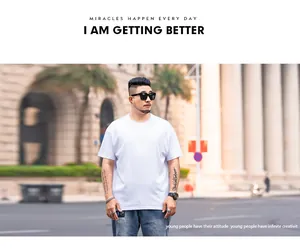 Model wearing oversized white cotton t-shirt with loose fit and drop shoulder design