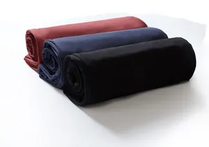 Three colors of men's plus size sweatpants rolled neatly in burgundy, navy, and black