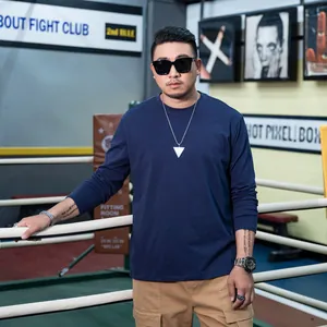 Plus size men's navy blue crew neck long sleeve plain casual t-shirt on model