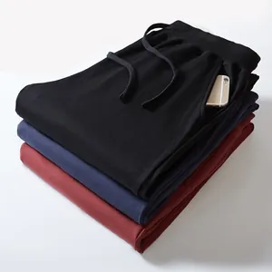 Men's loose plus size cotton joggers in black, navy, and burgundy with elastic waist
