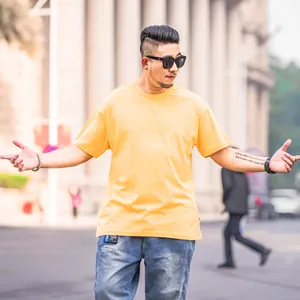 Men's stylish oversized dropped shoulder short sleeve T-shirt in solid bright yellow cotton
