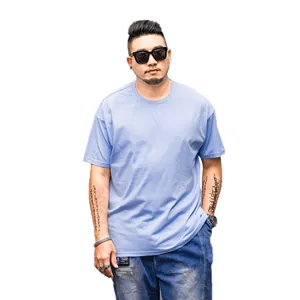 Stylish oversized light blue short sleeve cotton T-shirt for men with a relaxed drop shoulder fit