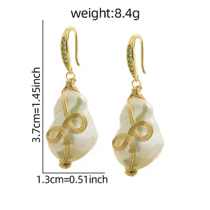 Pendientes de perlas barrocas con envoltura de hilo dorado e información de peso 8.4g