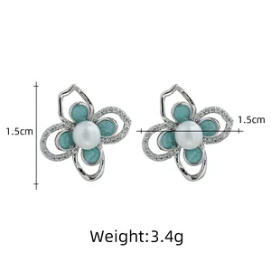Eleganti orecchini a fiore in argento S925 con perla naturale e smalto blu pavone