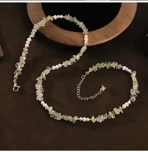 Detailed view of handmade natural freshwater pearl and prehnite crystal bead necklace.