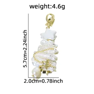 Handcrafted Christmas tree pendant with natural baroque pearls and gold-plated stars.