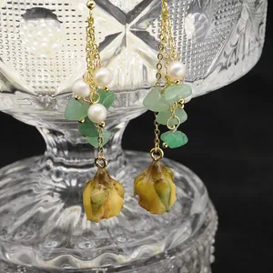 Handmade natural freshwater pearl long dangle earrings with green stones and yellow buds