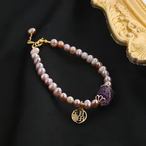 Elegant natural purple freshwater pearl bracelet featuring golden Fu charm and amethyst bead