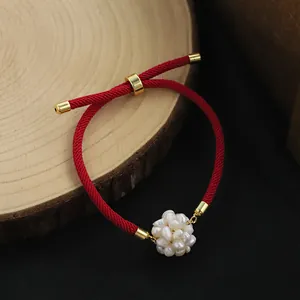 Handmade red string bracelet with natural freshwater pearl cluster and gold hardware