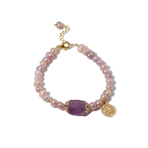 Handcrafted natural purple freshwater pearl bracelet featuring a lucky Fu charm and amethyst bead