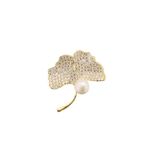 Elegant gold ginkgo leaf brooch with crystals and natural freshwater pearl accessory