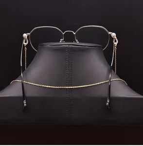 Detail view of a minimalist gold metal glasses chain with silicone loops