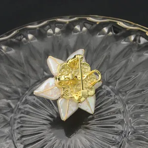 High-end handmade baroque pearl sunflower brooch showing the intricate golden back design