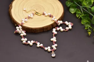 Detail view of tourmaline and freshwater pearl necklace with waterdrop pendant