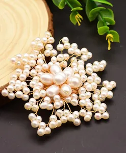 Exquisite macro detail of natural freshwater pearl flower brooch with gold wire weaving