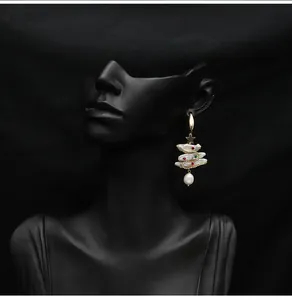 Elegant handmade baroque pearl Christmas tree drop earring displayed on a black mannequin