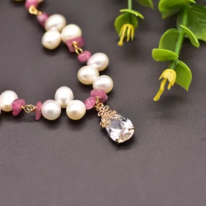 Handmade 18K gold necklace featuring natural tourmaline and white freshwater pearls