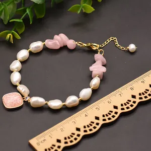 Handmade baroque pearl and rose quartz bracelet with gold-plated clasp and ruler for scale