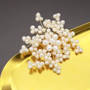 Elegant flower shape brooch handmade with natural white freshwater pearls and gold wire