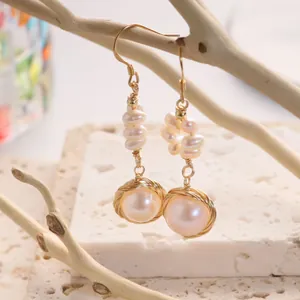 Handmade wire-wrapped 18K gold earrings with natural pearls in a vintage elegant style.
