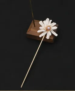 Detailed view of natural baroque pearl sunflower hair stick with gold finish for Hanfu.