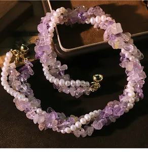 Close-up of triple-layer necklace with natural pearls and purple amethyst stones