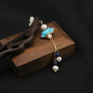 Traditional 15cm wooden hairpin featuring a blue enamel lotus flower and elegant pearl tassel.