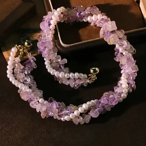 Elegant three-layer natural amethyst and pearl necklace with a vintage gold-tone clasp.