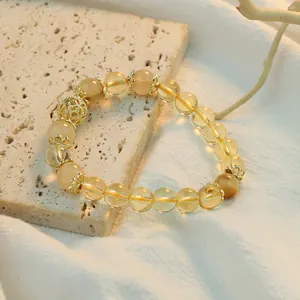 Elegant yellow crystal beaded bracelet with intricate gold filigree accents for women