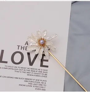 Exquisite macro detail of natural baroque pearl sunflower hair pin with 18K gold plating
