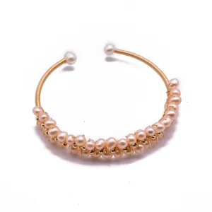 Elegant handmade gold wire-wrapped cuff bracelet with pink natural freshwater pearls