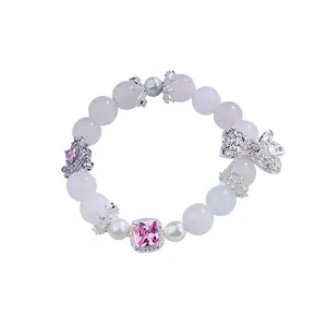 Elegant pink crystal beaded bracelet with butterfly charm and crown spacers for women
