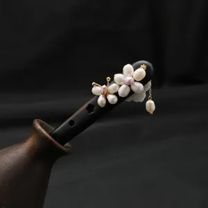 Handcrafted natural pearl ebony wood hair stick with an elegant floral tassel design