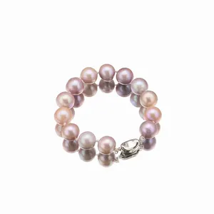 Elegant round Edison pearl bracelet with polished 925 silver clasp on white background