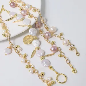 Elegant gold chain necklace with baroque pearls, lavender accents, and leaf charms.