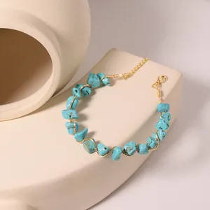 Handmade turquoise wire-wrapped bracelet with gold chain and lobster clasp closure