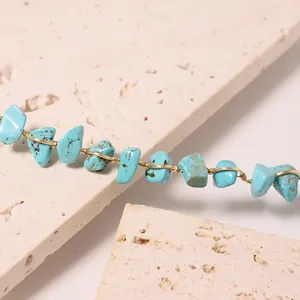 Handcrafted turquoise wire-wrapped bracelet with natural irregular stone beads