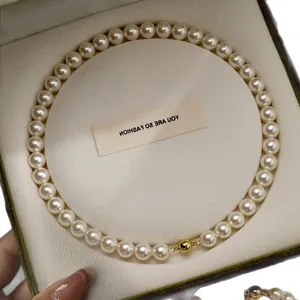 Elegant white pearl necklace with a minimalist gold magnetic clasp jewelry gift.