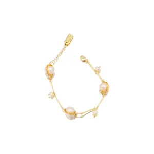 Handmade freshwater pearl bracelet with 18k gold plated wire wrapped vintage design.