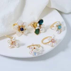 Collection of elegant handmade natural pearl flower rings with wire-wrapped adjustable bands