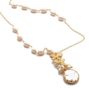 Elegant natural freshwater pearl necklace with gold butterfly and baroque pearl pendant.