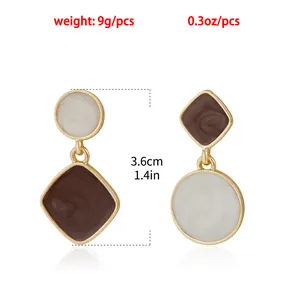 Close-up of geometry swirl enamel earrings with 3.6cm length and 9g weight specs