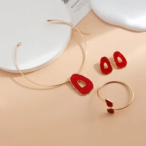 Close-up detail view of a vintage irregular red enamel jewelry set with choker and bracelet