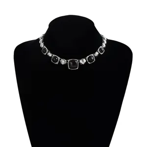 Detail view of vintage silver choker necklace with geometric black square stones