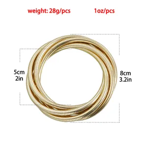 Detail view of gold snake bone bracelet showing 28g weight and 8cm diameter dimensions.
