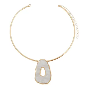 Retro gold collar necklace featuring a large irregular hollow white resin pendant for women