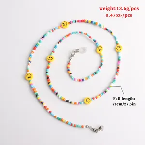 Detailed view of colorful seed bead glasses chain with smiley faces and size specs